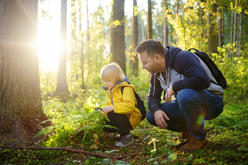 Image of a school boy and his father hiking together